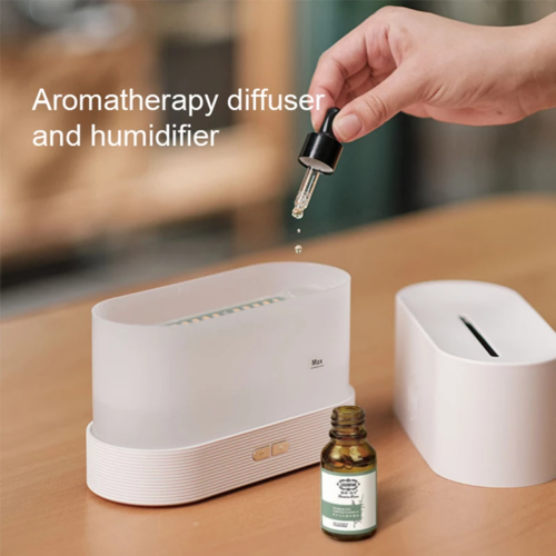 Aroma Diffuser Air Humidifier Flame Lamp Difusor en uso, añadiendo aceites esenciales.