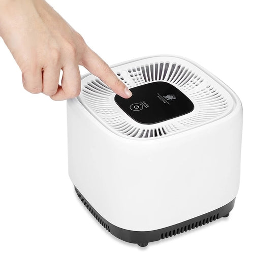 Air Purifier & Plant Stand with a user activating the control panel for better air quality.